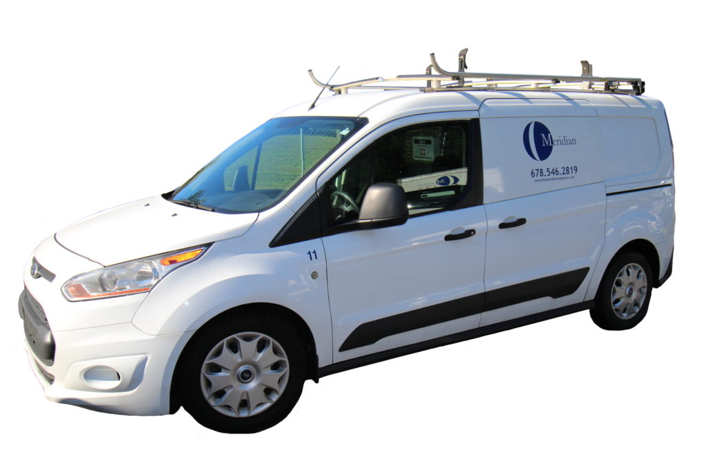 An image of a white van with the Meridian Restoration & Reconstruction branding accross its side.