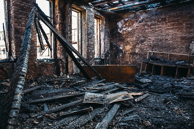 An image of the interior of a house in the aftermath of a fire.
